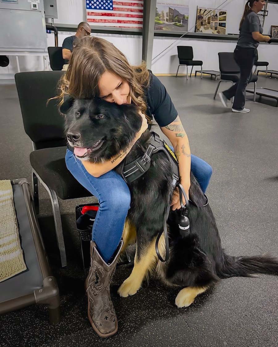 Holly Hugging Benji at the K9P4P Training Campus.